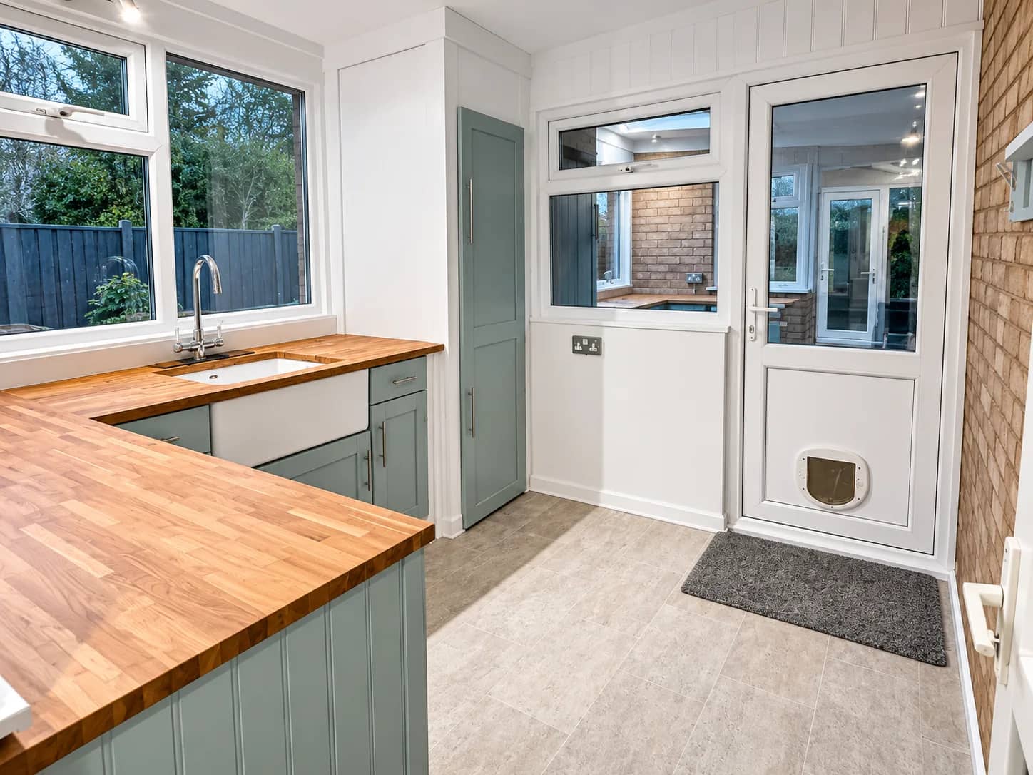 An oak-worktop kitchen left clean after an oven and appliance valet.